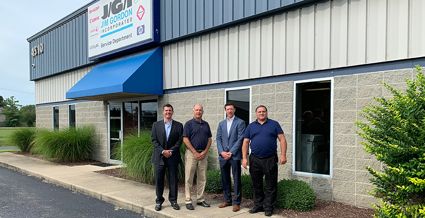 gfc-employees-standing-in-front-of-building